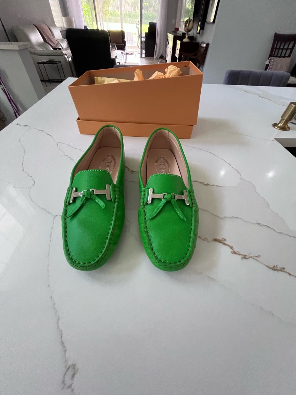 Tod's women’s size 38 Green Leather Driving Loafers with silver tone “T” hrdware